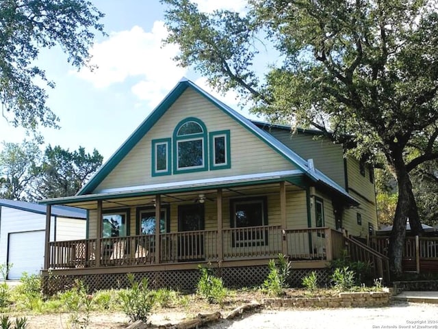 view of front of property with a porch and a garage