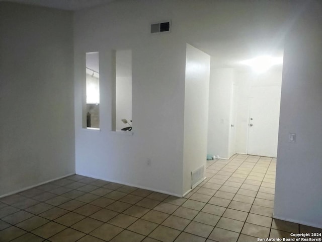 empty room with light tile patterned floors