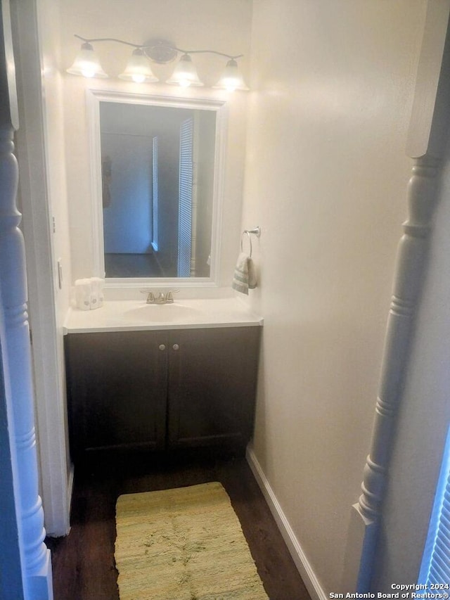 bathroom featuring vanity and wood-type flooring