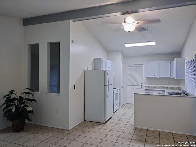 kitchen with white appliances, sink, light tile patterned flooring, white cabinetry, and lofted ceiling with beams