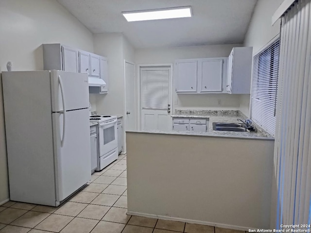 kitchen featuring white appliances, light tile patterned floors, sink, and white cabinets