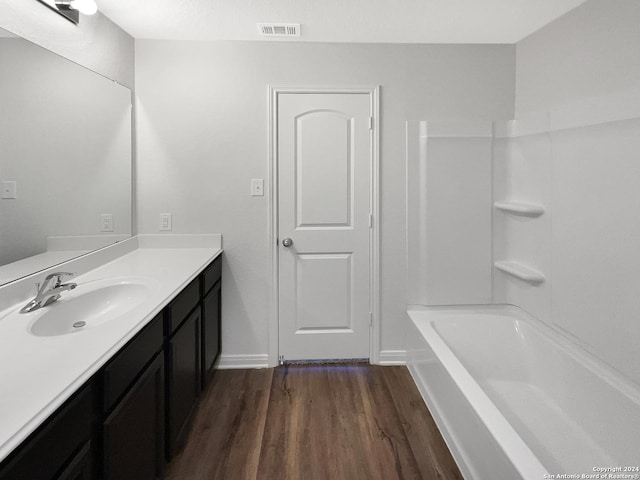 bathroom with vanity and hardwood / wood-style floors