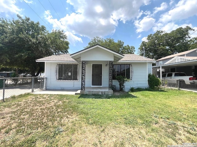 bungalow-style home featuring a front yard