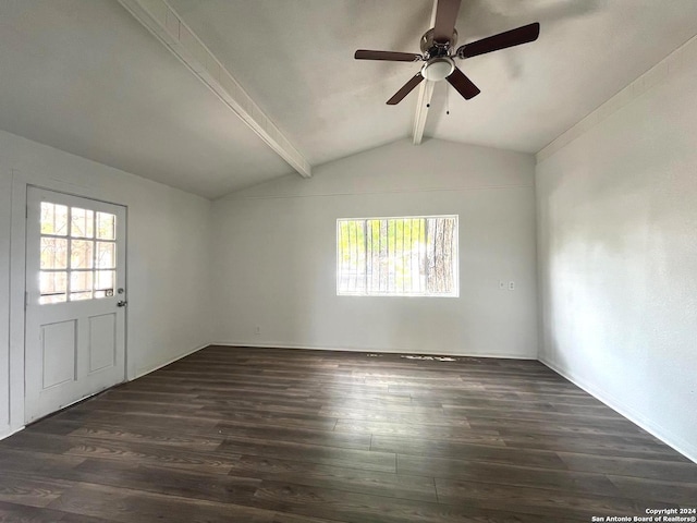 empty room featuring ceiling fan, vaulted ceiling with beams, and dark wood-type flooring