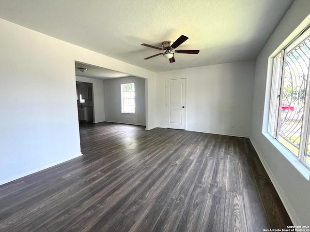 empty room featuring ceiling fan and hardwood / wood-style floors