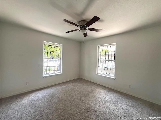 unfurnished room featuring carpet floors and ceiling fan