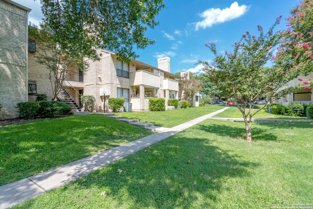 view of community featuring a lawn