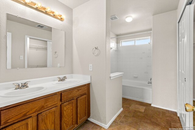 unfurnished bedroom featuring dark carpet, a closet, and ceiling fan