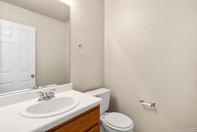 carpeted empty room featuring a textured ceiling and ceiling fan