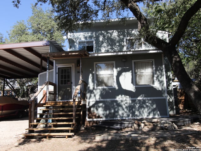 view of front facade with a carport