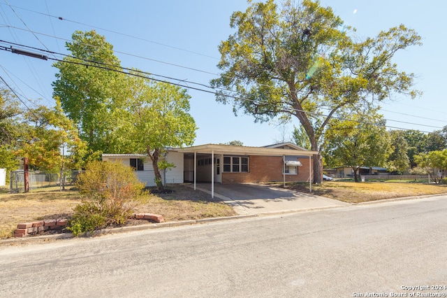 view of front of home with a carport