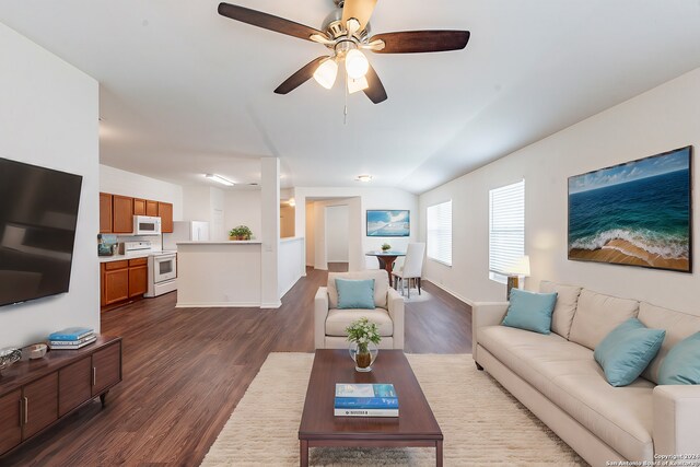 unfurnished living room with dark wood-type flooring and ceiling fan