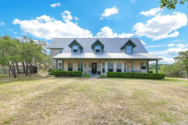 view of front facade featuring a front lawn and covered porch