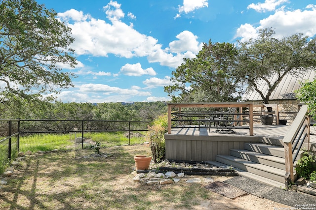 view of yard featuring a wooden deck