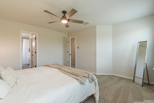 bedroom featuring carpet floors, connected bathroom, and ceiling fan