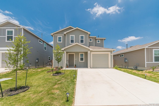 front facade featuring a garage and a front lawn