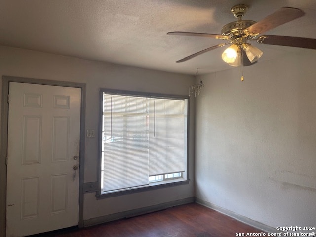 entrance foyer with ceiling fan and hardwood / wood-style floors