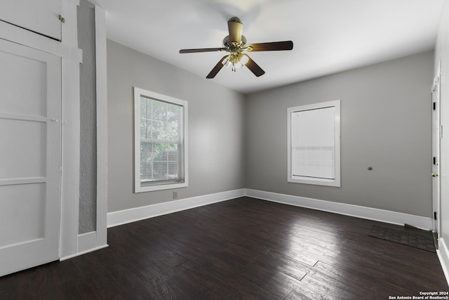 unfurnished bedroom featuring dark hardwood / wood-style floors and ceiling fan