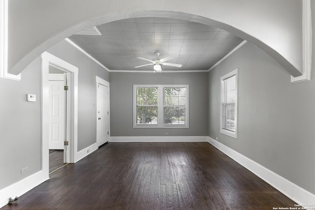 unfurnished room with dark wood-type flooring, ceiling fan, and ornamental molding