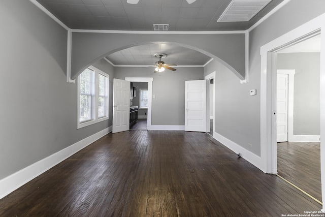 interior space featuring ceiling fan, ornamental molding, and dark hardwood / wood-style floors