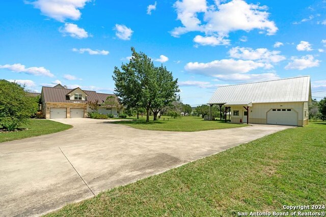 view of front facade with a garage and a front lawn