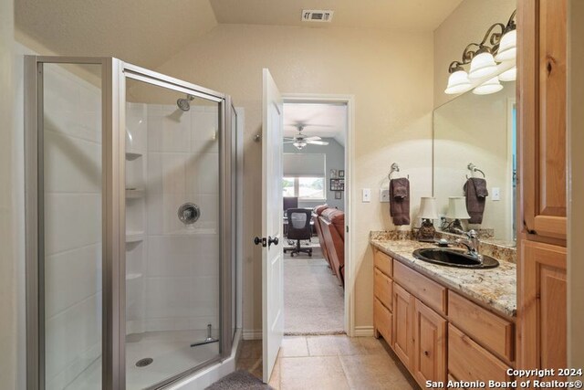 bathroom with vanity and an enclosed shower