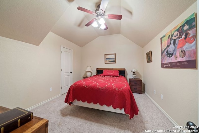 carpeted bedroom featuring vaulted ceiling and ceiling fan