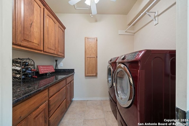 washroom featuring cabinets, light tile patterned floors, washer and dryer, and ceiling fan