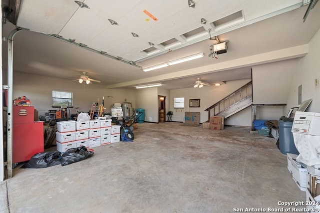 garage featuring a garage door opener and ceiling fan