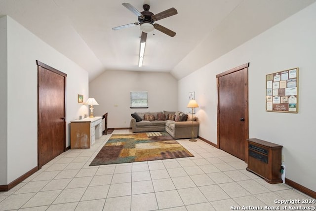 tiled living room featuring lofted ceiling and ceiling fan