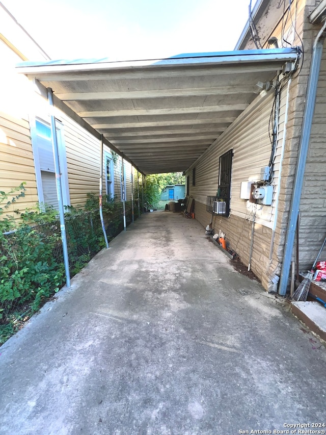 view of parking / parking lot with a carport