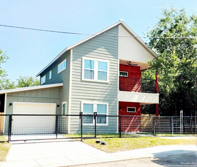 view of front of home featuring a garage and a balcony