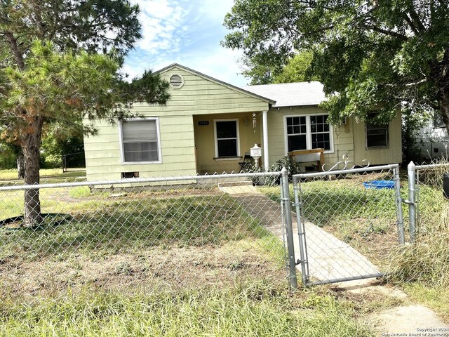 view of front of house featuring a fenced front yard and a gate