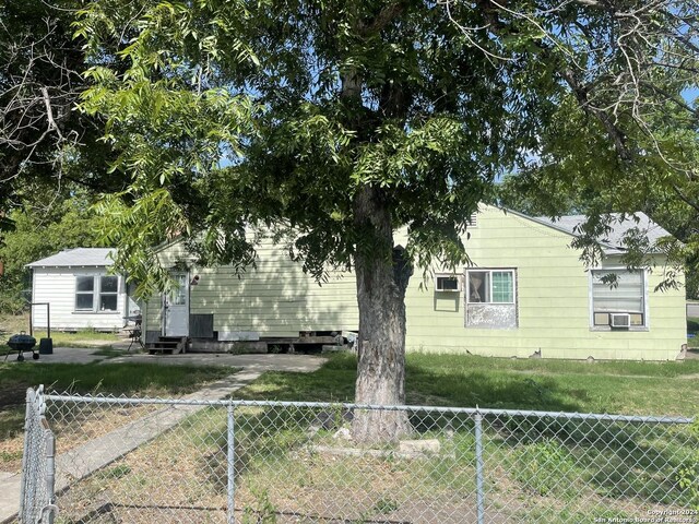 exterior space featuring fence private yard and entry steps