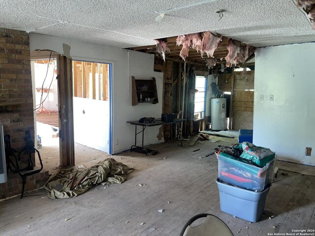 unfurnished living room with electric water heater