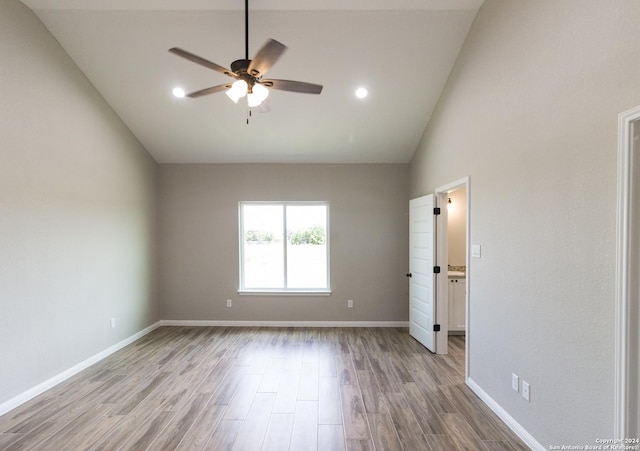 unfurnished bedroom with high vaulted ceiling, recessed lighting, a ceiling fan, baseboards, and light wood-style floors