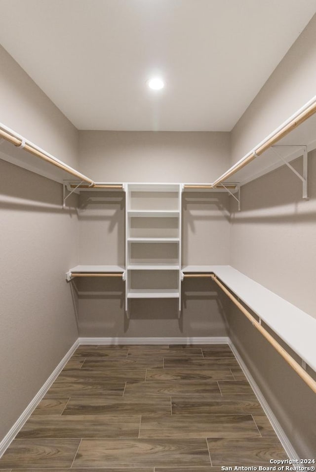 spacious closet featuring wood finish floors