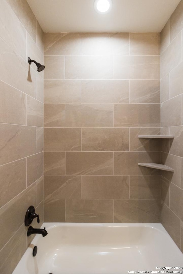 bathroom with washtub / shower combination