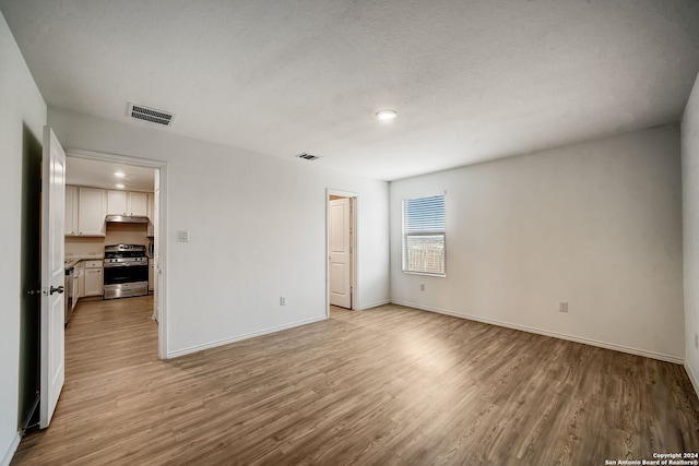 unfurnished living room featuring light wood-type flooring