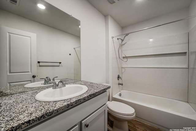 full bathroom featuring vanity, shower / bath combination, wood-type flooring, and toilet