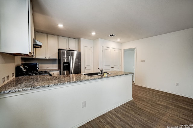 kitchen with range, sink, dark hardwood / wood-style floors, stainless steel refrigerator with ice dispenser, and ventilation hood