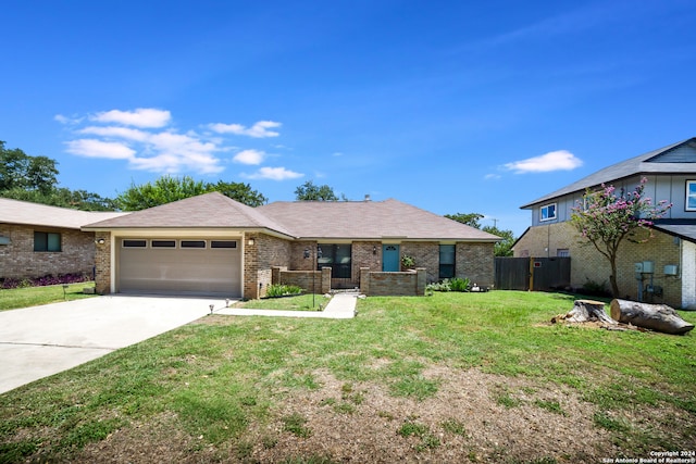 view of front of home featuring a garage and a front lawn