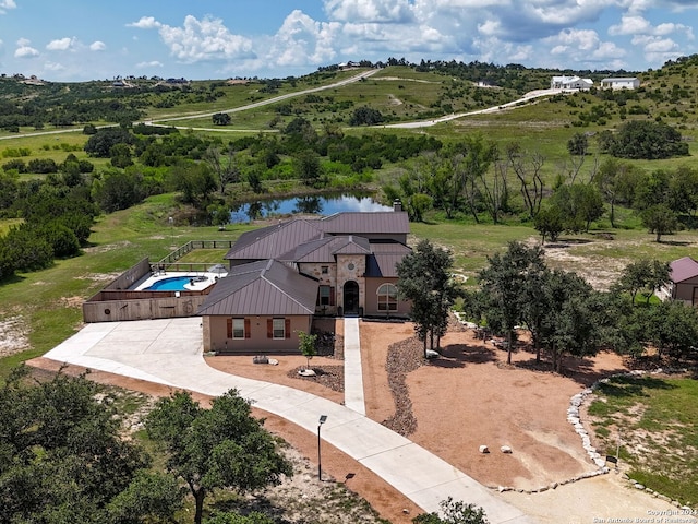 drone / aerial view with a water view and a rural view