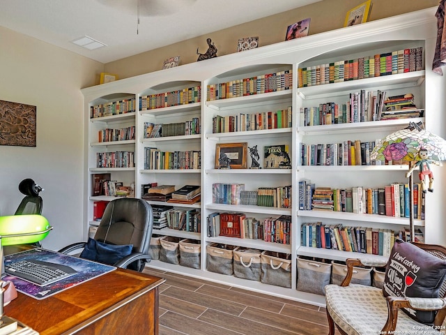 living area with dark hardwood / wood-style floors and a textured ceiling