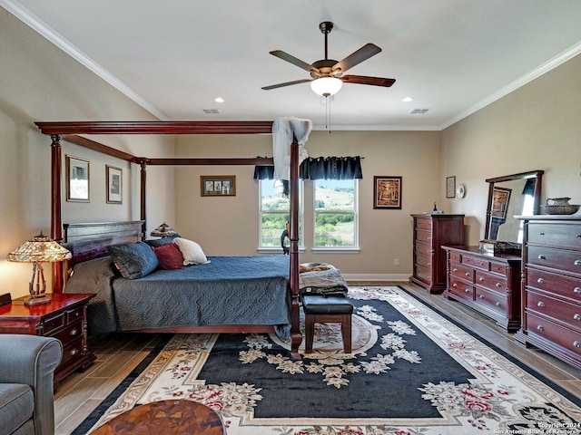 bedroom featuring ceiling fan, hardwood / wood-style flooring, and ornamental molding