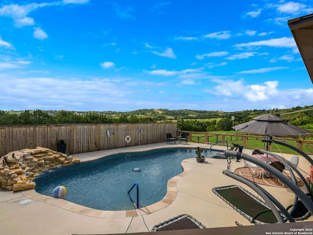 view of swimming pool featuring a patio