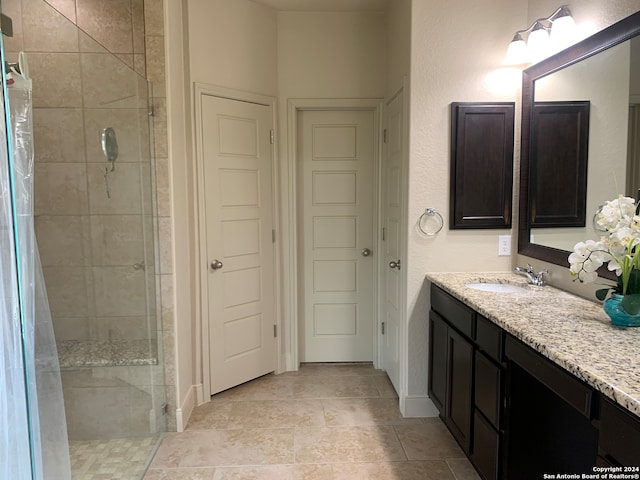 bathroom with vanity and tile patterned floors