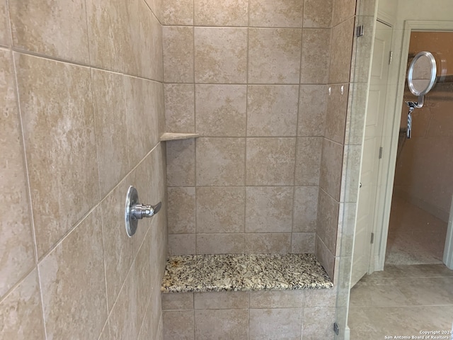 bathroom with tiled shower