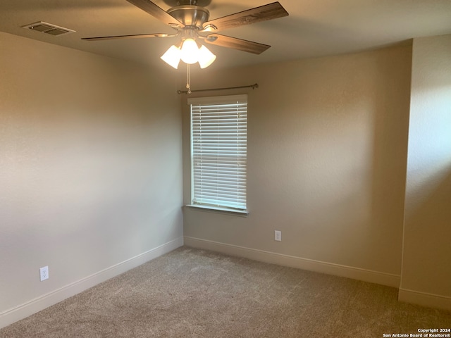 carpeted empty room with ceiling fan