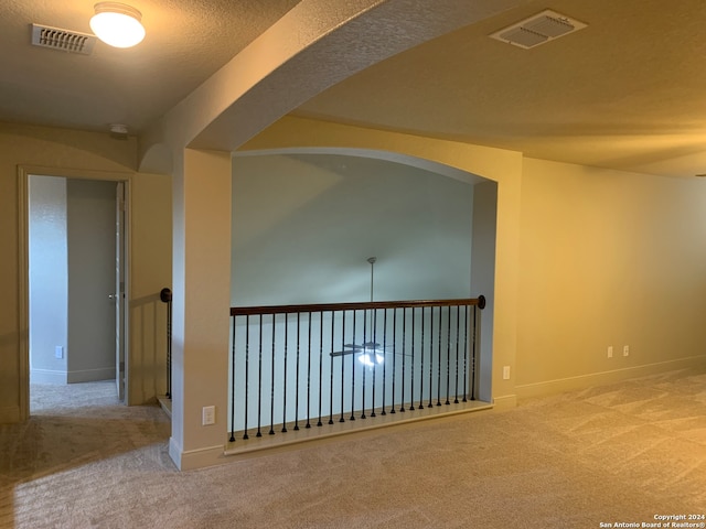 empty room with light colored carpet